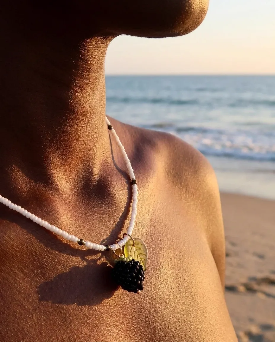 Pearl necklace worn by a model in warm evening light